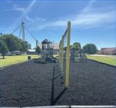 Taloga playground area surfaced in black rubber mulch